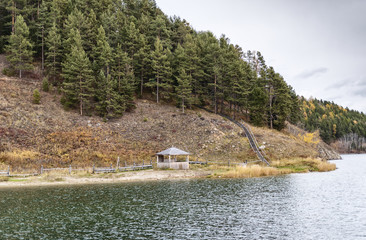 wooden stairs and a gazebo on the lake