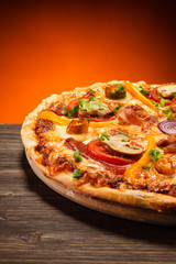 Pizza with salami and mushrooms 