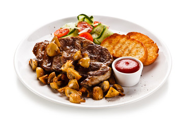 Grilled steak with toasts and vegetables on white background