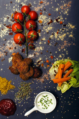 Obraz na płótnie Canvas Fried meatballs with vegetables and spices