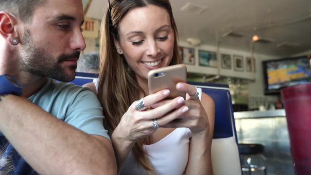 Young couple connected with smartphone