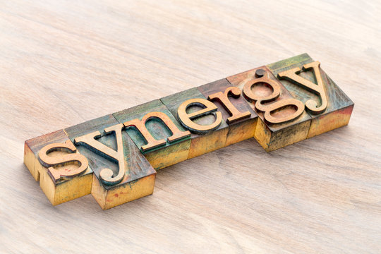 synergy word abstract in wood type