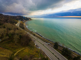 Drone view of Kurortnyy Prospekt and Black Sea in cloudy autumn day, Sochi, Russia
