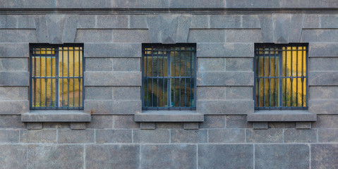 Fototapeta na wymiar Three windows in a row on the facade of the urban historic building front view, Saint Petersburg, Russia 