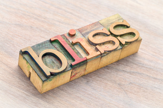 bliss word abstract in wood type