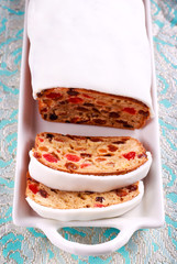 Fruit cake with icing, sliced