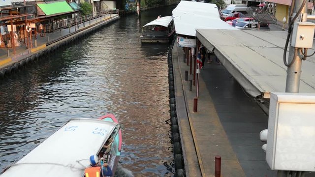 Bangkok, Thailand - January 27, 2018 : Saen Saep Khlong canal boats in asia arrive passengers through waterways of Bangkok