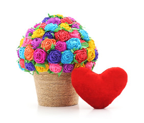 Paper flowers in vase with heart.