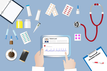 Top view of a medical table with doctor hands holding tablet with digital patient card.