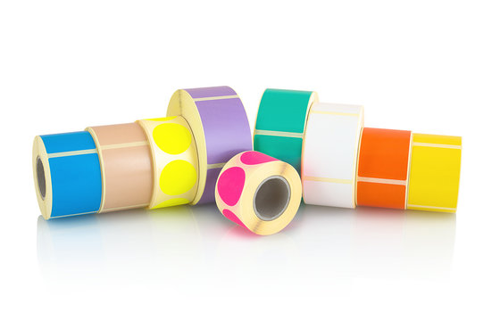 Colored label rolls isolated on white background with shadow reflection. Color reels of labels for printers. Labels for direct thermal or thermal transfer printing. Square and circle labels background