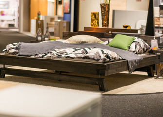 wooden bed in a room