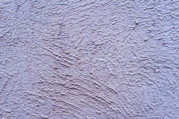 Rough concrete wall painted in gray - background, texture