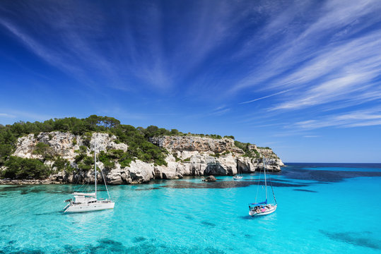 Fototapeta Beautiful bay with sail boats, Menorca island, Spain. Sailing and yachting concept