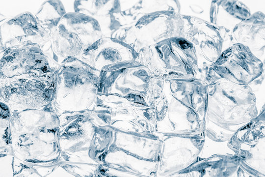 Natural ice cubes on white background pattern.