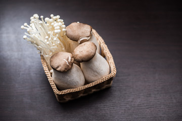 Obraz na płótnie Canvas Mushroom in The basket weave on wood background.