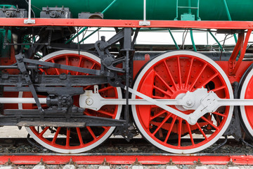red wheel and detail of mechanism a vintage russian steam train locomotive