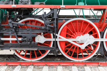 red wheel and detail of mechanism a vintage russian steam train locomotive