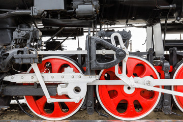 red wheel and detail of mechanism a vintage russian steam train locomotive
