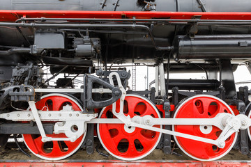 red wheel and detail of mechanism a vintage russian steam train locomotive