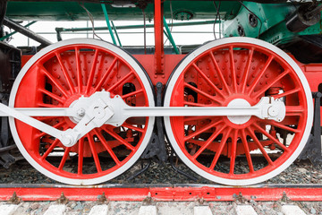 red wheel and detail of mechanism a vintage russian steam train locomotive