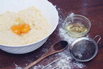 Dough Preparation Recipe Bread, Pizza, Pie , food flat lay on kitchen table background. Butter, milk, yeast, flour, eggs, sugar pastry , spoon, plate, bowl, or bakery cooking
