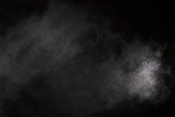 White powder. Grainy abstract texture on black background.