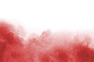 Red powder explosion on white background. Colored cloud. Colorful dust explode. Paint Holi.