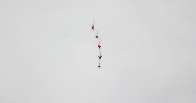 Men go skitour in deep snow forest