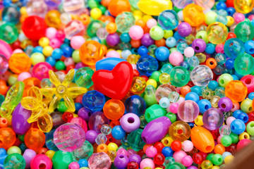 Fototapeta na wymiar Backdrop with tiny colored glass seed beads