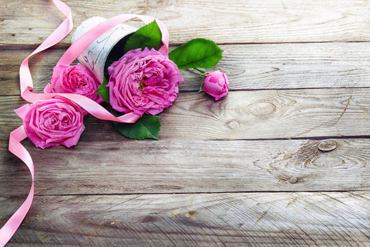 pink roses bouquet on  wooden background