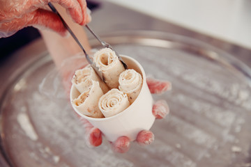 Fototapeta na wymiar Ice cream roll. Thailand stir-fried ice cream rolls at freeze pan