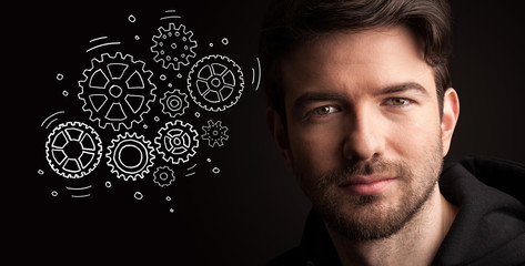 Portrait of a young businessman on dark background