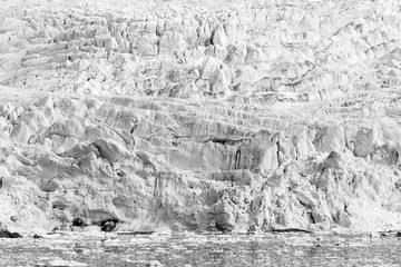 Sea bay with a glacier and icebergs in Svalbard, Spitsbergen, Norway