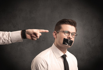 Business hand pointing at employee