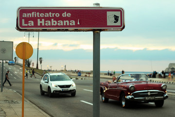 Street sign of  Havana and old timer cars, Cuba