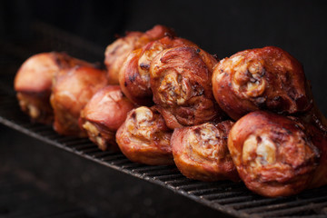 appetizing bird legs cooked on the grill