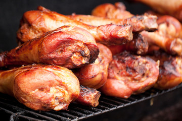 appetizing bird legs cooked on the grill