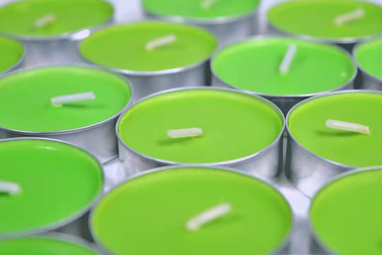 Green candle, several irregularly gathered