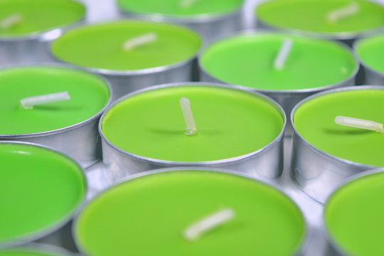 Green candle, several irregularly gathered