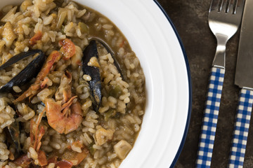 spanish paella plate on dark background