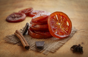 Stack of candied orange, cinnamone and chocolade.