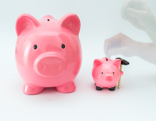 Big and little piggy moneybox as a saving concept.