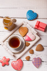 gingerbread cookies over white wooden background