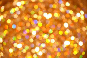 Yellow and orange bokeh background . Yellow bokeh from natural . Christmas light background. Holiday glowing backdrop. Defocused Background With Blinking Stars. Blurred Bokeh. 