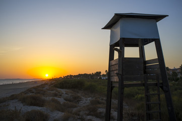 Life guard tower at sunset close to Islantilla beach