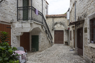 Fototapeta na wymiar TROGIR, CROATIA: Small alley in the ancient city of Trogir, Croatia