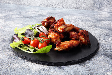 crispy barbecue chicken wings bbq on grey background