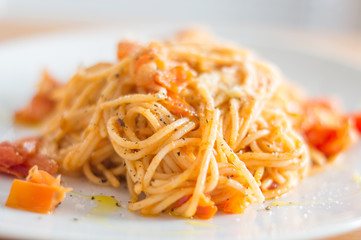 Classic tomato spaghetti with parmesan.