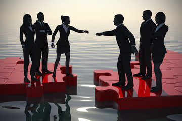 Merger of two teams on a jigsaw puzzle at sunset.
Two teams of successful executives merging on a jigsaw puzzle at sunset showing a partnership.