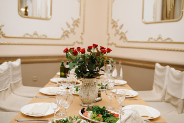 Photo of cheese platter and salad on the table